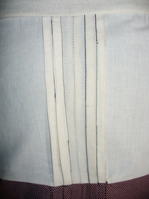 close up of pleats, all done in black thread so you can see where I've sewn